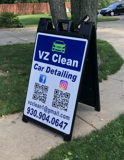 Sidewalk A-frame sign for a car detailing service with QR codes