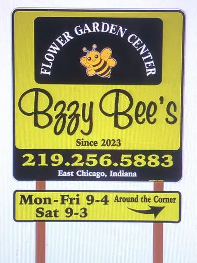 Business sign with hours mounted on posts