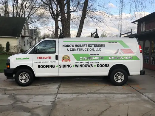 White service van with lettering, side view